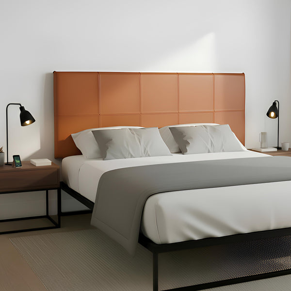 Modern bedroom with a bed, wooden headboard, and side tables.